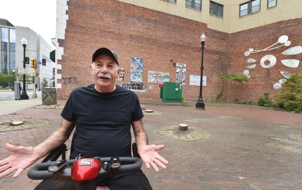 Gregory Gosselin, a resident of downtown Fall River, said he used to come to Gerald Lawton Plaza to sit in the shade, and wanted to know why the trees were cut down. The park is being redesigned, and new trees will be planted.