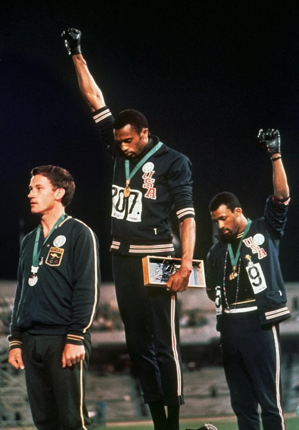 <p>At the Mexico Olympics in 1968, two black athletes made history with their silent protest against racial discrimination. Tommie Smith and John Carlos stood on the winners’ podium with their heads bowed and their black-gloved fists raised, quietly demonstrating against the continued racism that plagued America. (AP) </p>