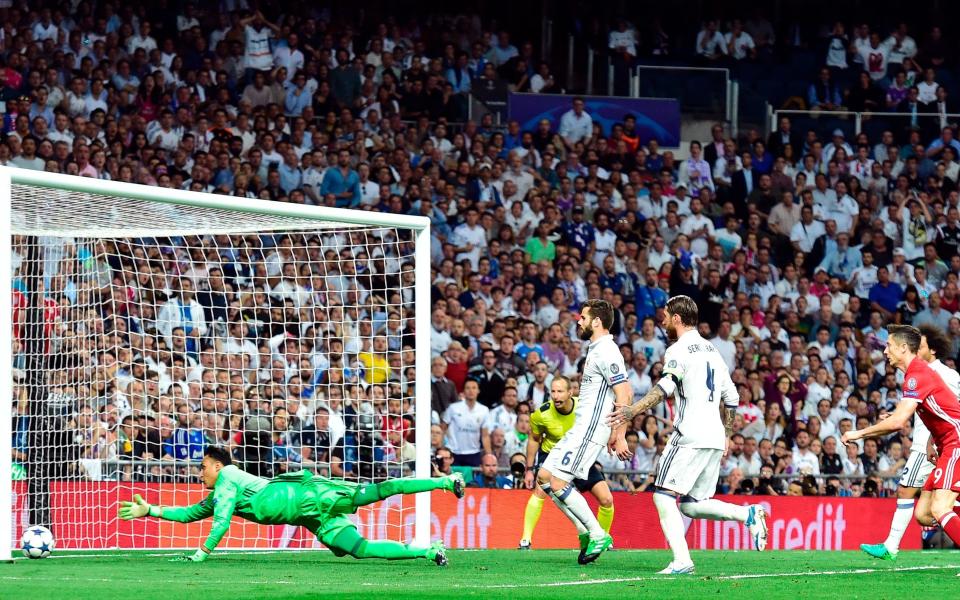 Real Madrid's Costa Rican goalkeeper Keylor Navas (L) tries to stop an own goal by Real Madrid's defender Sergio Ramos  - Credit: GETTY