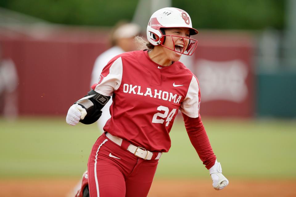 OU's Jayda Coleman (24) celebrates after hitting a home run in the first inning of a 3-2 win against Texas A&amp;M on Saturday in the NCAA softball tournament in Norman.