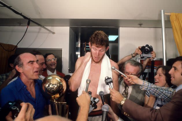 Basketball: NBA Finals: Portland Trail Blazers Bill Walton during media interview as coach Jack Ramsay (L) holds NBA Championship Trophy in locker room after winning Game 6 and series vs Philadelphia 76ers at Memorial Coliseum. Portland, OR 6/5/1977CREDIT: Hank Delespinasse (Photo by Hank Delespinasse /Sports Illustrated via Getty Images)(Set Number: X21523 TK3 R1 F33 )
