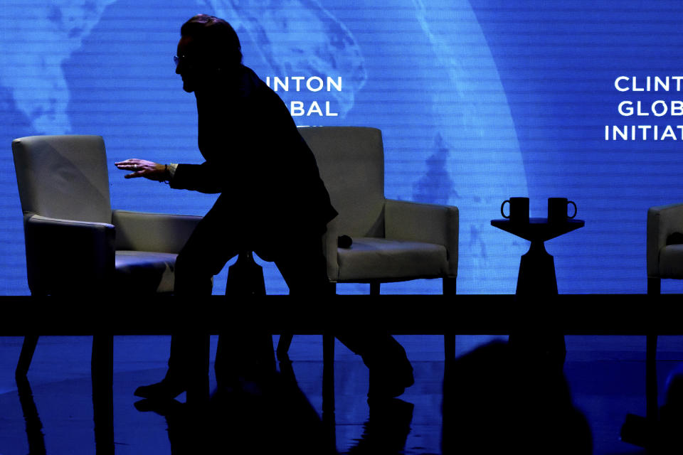 Bono creeps off the stage at the Clinton Global Initiative, Tuesday, Sept. 20, 2022, in New York. (AP Photo/Julia Nikhinson)