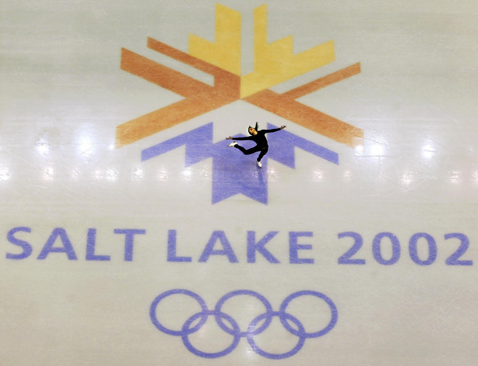 FILE - In this Feb. 8, 2002, file photo, U.S. champion Michelle Kwan practicing for the women's short program for the Winter Olympic Games at the Salt lake Ice Center in Salt Lake City. Salt Lake City may shift its focus to bidding for the 2034 Winter Olympics rather than the games four years earlier following the announcement last month that Sapporo, Japan will bid for 2030, organizing committee members said Wednesday, Feb. 12, 2020. (AP Photo/Doug Mills, File)