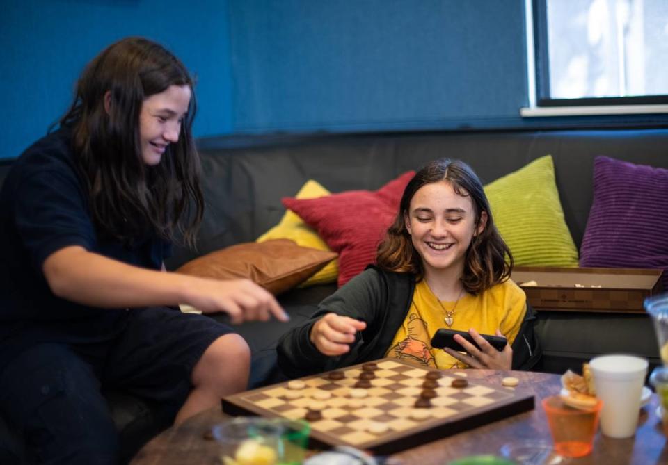 Paso Robles teens play checkers at the new teen center located in the Centennial Park gymnasium on opening day.