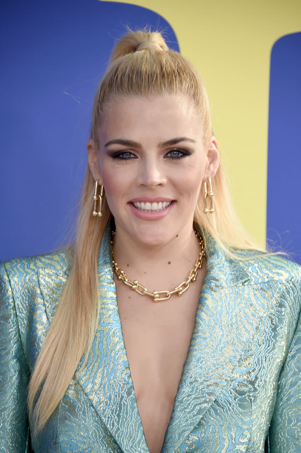 <p>By putting your into a super high pony, you can add the illusion of fullness (just look how voluminous actress <strong>Busy Phillipps'</strong> hair looks!). Plus, wrapping hair to tie it instead of an elastic adds more volume. </p>