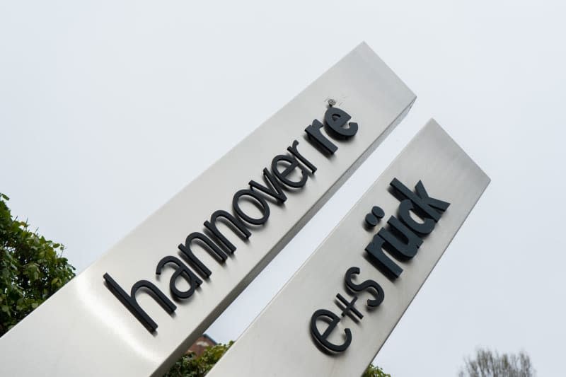 A Hannover Re sign stands in front of the insurance company's headquarters. The preliminary group net income at German reinsurance firm Hannover Re grew to €1.8 billion ($1.9 billion) from last year's €0.78 billion, the company reported on Wednesday. Raphael Knipping/dpa