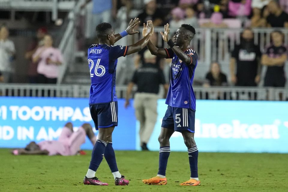 FC Cincinnati midfielder Obinna Nwobodo (5) celebrates with midfielder Malik Pinto (26) after defeating Inter Miami 1-0 in an MLS soccer match, Saturday, Oct. 7, 2023, in Fort Lauderdale, Fla. (AP Photo/Rebecca Blackwell)