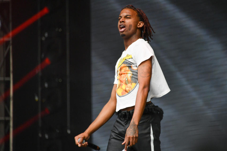 Playboi Carti performing at Governor’s Ball, wearing a white t-shirt and Black pants
