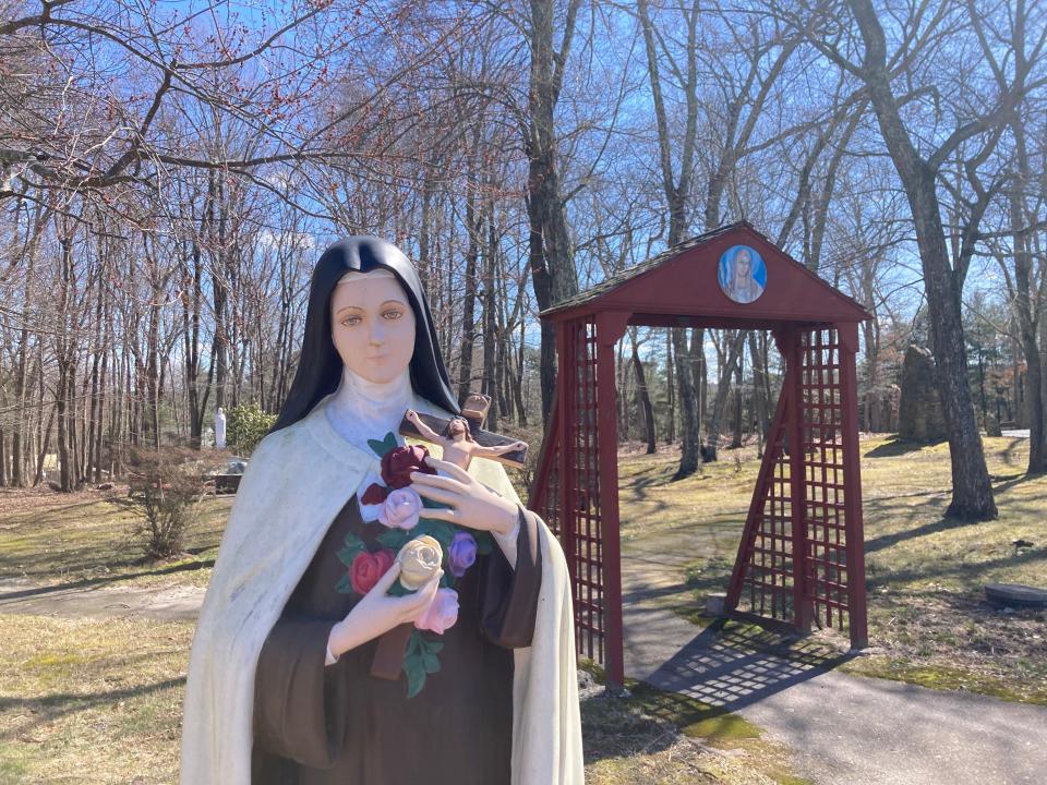 A statue of Saint Thérèse of Lisieux, also known as The Little Flower, at the Burrillville shrine named in her honor. She is the patron saint of florists, foreign missions, loss of parents, priests and the sick.