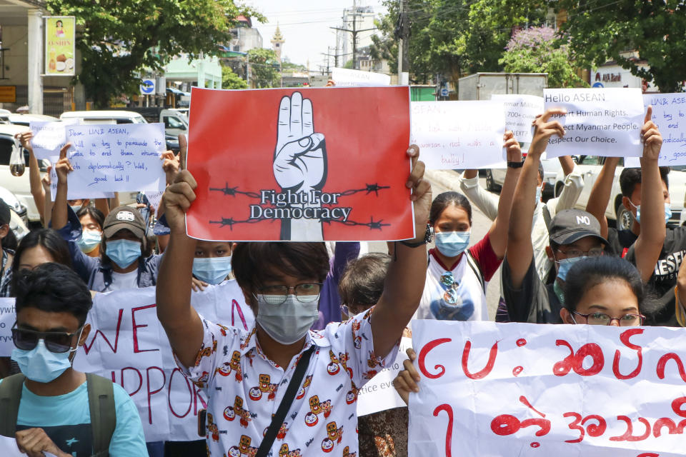 Anti-coup protesters march on the street during a demonstration in Yangon, Myanmar, on Friday, April 23, 2021. Leaders of the 10-member Association of Southeast Asian Nations meet Saturday, April 24, in Jakarta to consider plans to promote a peaceful resolution of the conflict that has wracked Myanmar since its military launched a deadly crackdown on opponents to its seizure of power in February. (AP Photo)