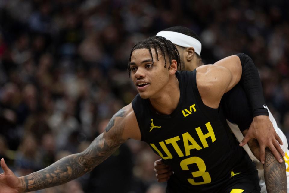 Utah Jazz guard Keyonte George (3) posts up against Golden State Warriors guard Gary Payton II (0) during a game at the Delta Center in Salt Lake City on Monday, Feb. 12, 2024.