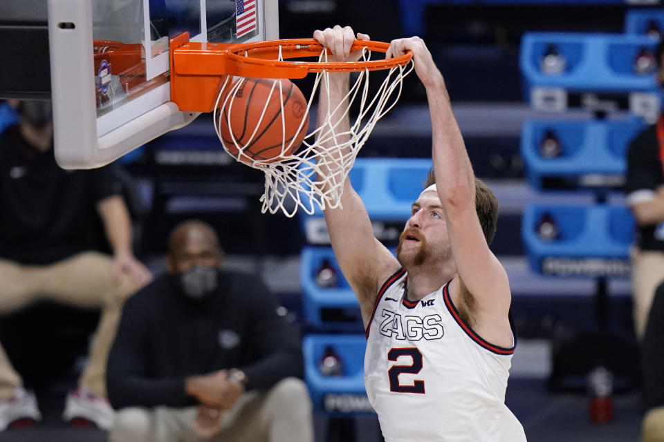 FILE - Gonzaga forward Drew Timme (2) dunks against Creighton in the second half of a Sweet 16 game in the NCAA men's college basketball tournament at Hinkle Fieldhouse in Indianapolis, in this Sunday, March 28, 2021, file photo. The Zags were the runaway top choice in The Associated Press Top 25 men’s college basketball preseason poll released Monday, Oct. 18, 2021. Gonzaga lost AP All-Americans Corey Kispert and Jalen Suggs to the NBA, but second-team selection Drew Timme (19.0 points, 7.0 rebounds) and starting guard Andrew Nembhard return. (AP Photo/AJ Mast, File)