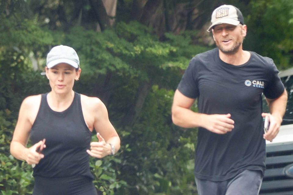 <p>BACKGRID</p> Actress Jennifer Garner and her boyfriend, John Miller, enjoy a morning jog together in Brentwood with smiles and cuteness on August 14, 2023