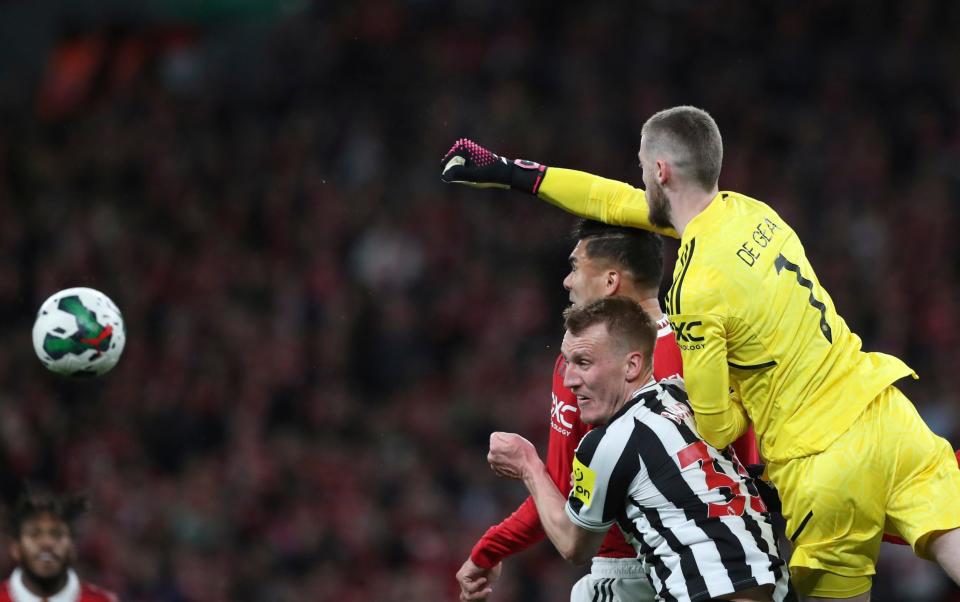 David de Gea, right, clears the ball over Manchester United's Brandon Williams - AP