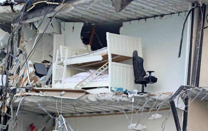 A bunk bed is seen in the rubble at Champlain Towers South Condo in Surfside, located at 8777 Collins Avenue, a part of which collapsed in the early morning in Surfside, Florida, Thursday, June 24, 2021.