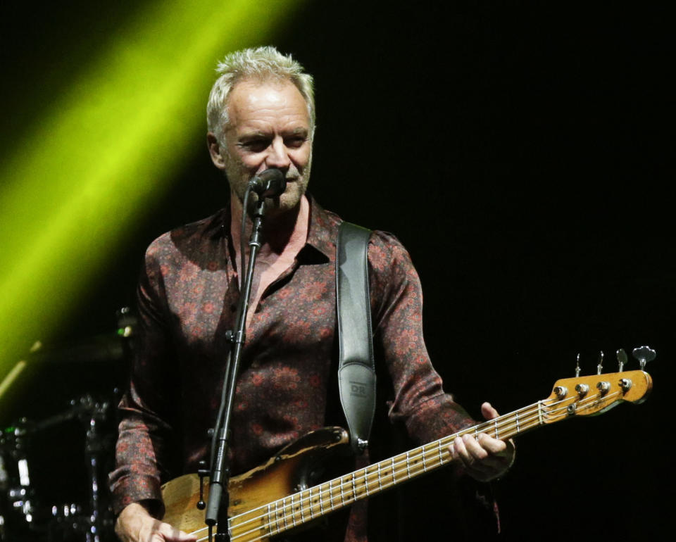 FILE - In this Oct. 19, 2018, file photo, singer Sting performs during a concert with singer Shaggy, not in frame, as part of their 'The 44/876' tour in Panama City. Sting, Christina Aguilera and revelers from around the world are set to welcome 2019 in New York City’s Times Square. (AP Photo/Arnulfo Franco)