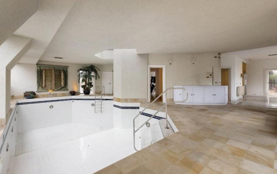 The indoor pool sits on the top floor of the three-storey home (Photography by Alex Winship. Furniture is virtually staged.)