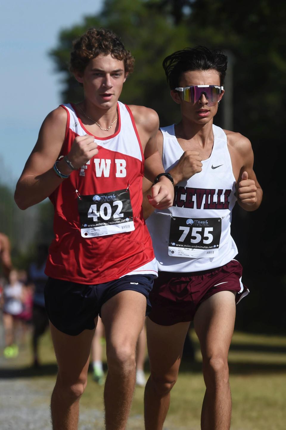 Fort Walton Beach's Grant Chastian, left, and Niceville's Alex Buena finished second and third place respectively in the Okaloosa County Cross Country Championships held Thursday, Oct. 13, 2022 at the Howard Hill Soccer Complex in Niceville.