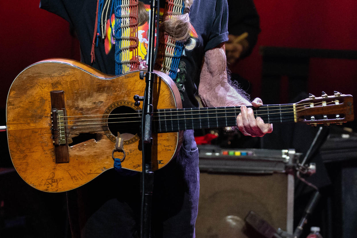 Willie Nelson and guitar Trigger (Suzanne Cordeiero / AFP via Getty Images)