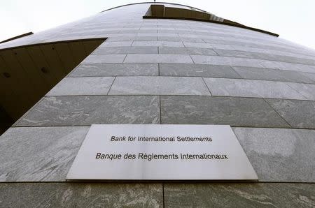 A sign is seen beside the entrance of the Bank for International Settlements (BIS) in Basel December 5, 2013. REUTERS/Arnd Wiegmann