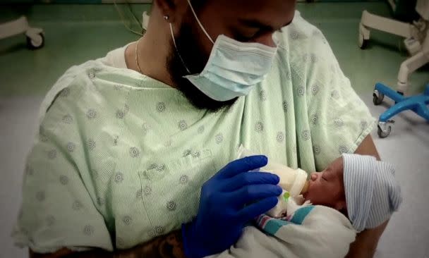 PHOTO: Omari Maynard is pictured feeding his newborn son.<p>(Onyx Collective/ABC News Studios)