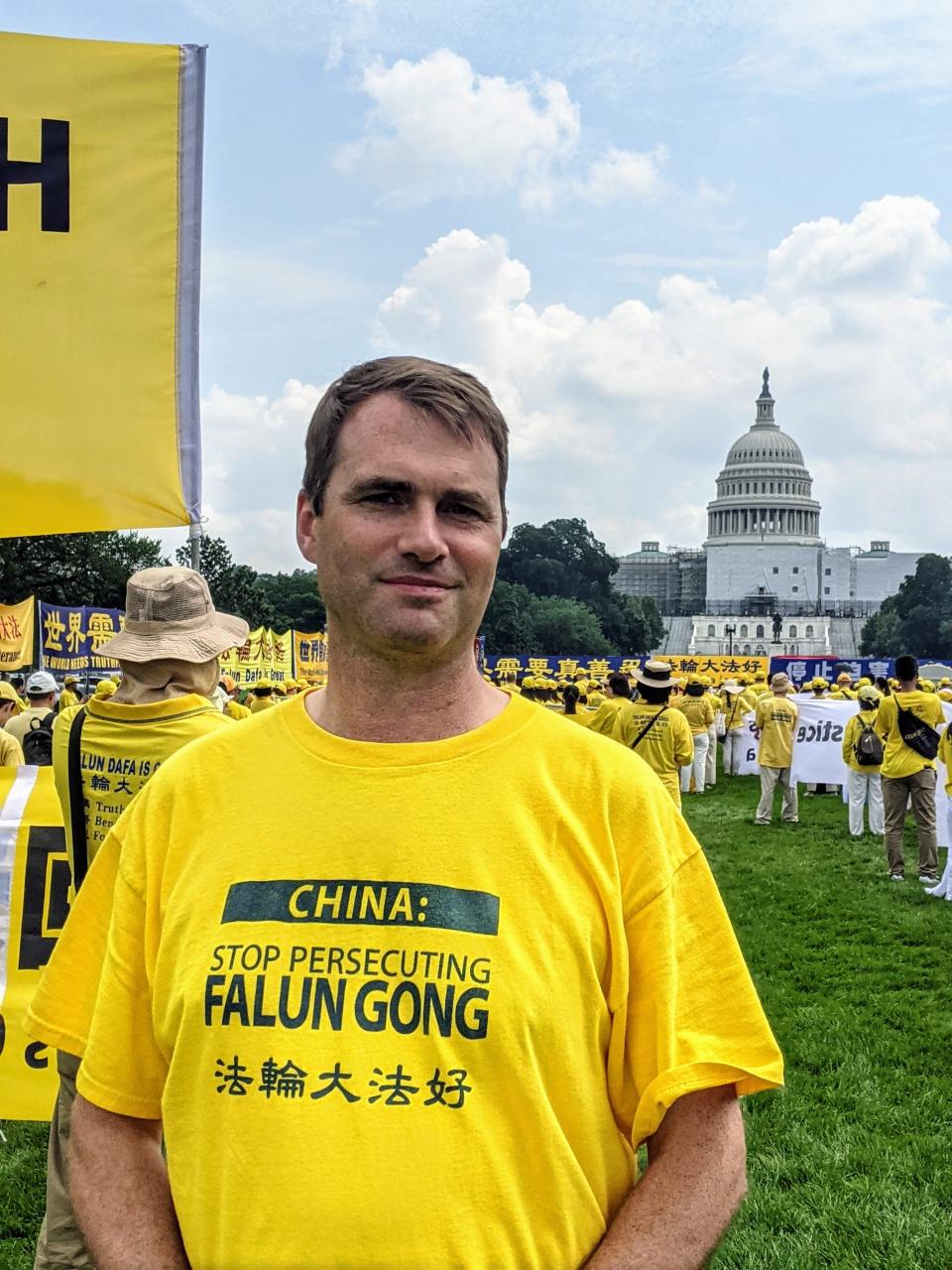 Pascack Valley and Hills Chinese teacher Liam O'Neill marching in Washington, D.C. to end the 24-year-long persecution of the spiritual practice Falun Gong in China.