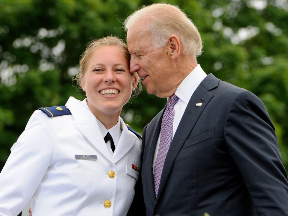 FILE - In this May 22, 2013 file photo, Newly commissioned officer Erin Talbot, left, poses for a photograph with Vice President Joe Biden during commencement for the United States Coast Guard Academy in New London, Conn. As former Vice President Biden's camp scrambles to contain any political damage over his past behavior with women, House Speaker Nancy Pelosi has some words of advice: Keep your distance.  (AP Photo/Jessica Hill) ORG XMIT: WX121