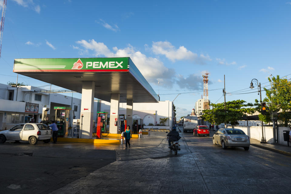 M&#xe9;rida, Mexico - November 27, 2014: A car fuels up at a Pemex gas station in M&#xe9;rida, the capital of the Mexican state of Yucat&#xe1;n. Pemex (or Petr&#xf3;leos Mexicano, which translates to Mexican Petroleum) is a Mexican state-owned petroleum company.