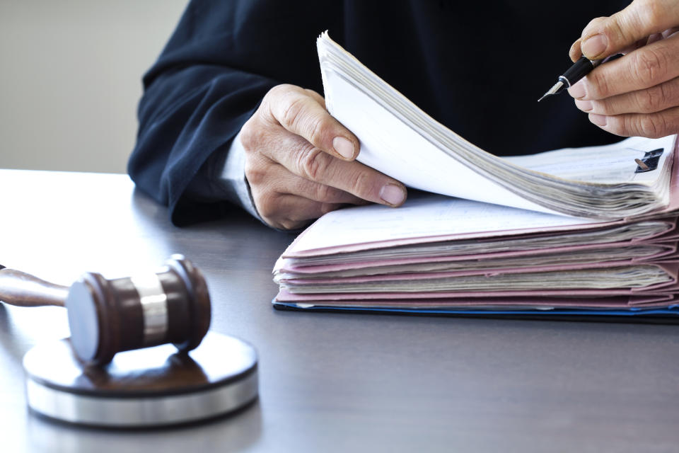 Judge with gavel on table