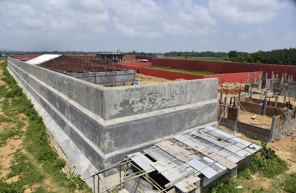 This Aug.29, 2019 photo, shows an under-construction building intended to function as detention center for people who are not included in the National Register of Citizens, (NRC) in Kadamtola Gopalpur village, in Goalpara district, in Assam, India. Nearly 2 million people, about half Hindu and half Muslim, were excluded from NRC, an official list of citizens and have been asked to prove their citizenship or else be considered foreign. India is building the detention center for some of the tens of thousands of people who the courts are expected to ultimately determine have entered illegally. (AP Photo)