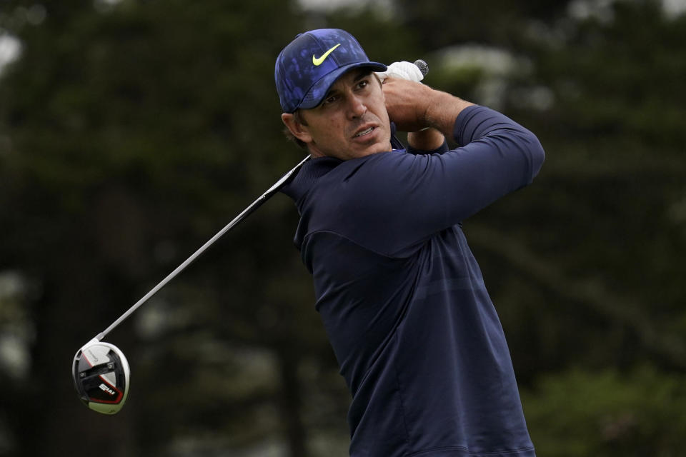 File-This Aug. 8, 2020, file photo shows Brooks Koepka watching his tee shot on the 14th hole during the third round of the PGA Championship golf tournament at TPC Harding Park in San Francisco. Koepka returns to competition this week after missing two months with a hip injury. (AP Photo/Jeff Chiu, File)