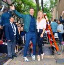 Ryan Seacrest tries to get on cohost Kelly Ripa’s level as she poses en pointe along with more than 300 dancers who broke the Guinness World Record for Most Ballet Dancers En Pointe Simultaneously outside <em>Live with Kelly and Ryan</em> on Tuesday in N.Y.C. 