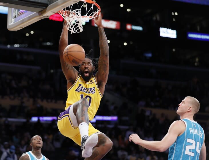 Los Angeles, CA, Monday, November 8, 2021 - Los Angeles Lakers center DeAndre Jordan (10) slam dunks over Charlotte Hornets center Mason Plumlee (24) in the first quarter at Staples Center (Robert Gauthier/Los Angeles Times)