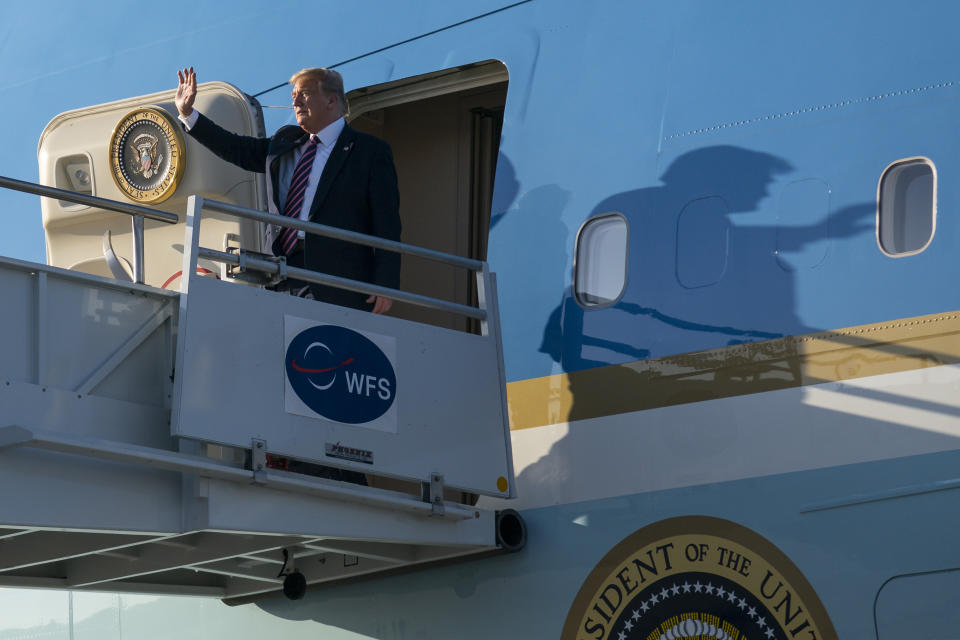 President Donald Trump arrives at Los Angeles International Airport, Tuesday, Feb. 18, 2020, in Los Angeles. (AP Photo/Evan Vucci)