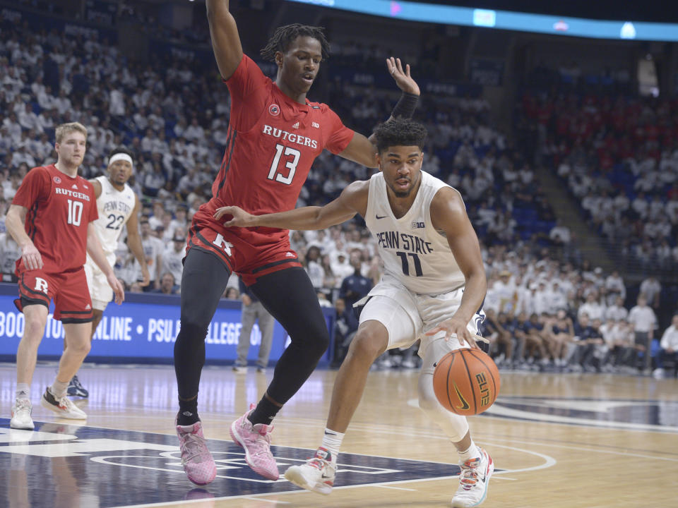 Rutgers' Antwone Woolfolk (13) defends against Penn State's Camren Wynter (11) during the first half of an NCAA college basketball game, Sunday, Feb. 26, 2023, in State College, Pa. (AP Photo/Gary M. Baranec)