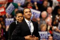 <p>Michelle hugs Barack before a speech in Nashua, New Hampshire [Photo: Win McNamee/Getty] </p>