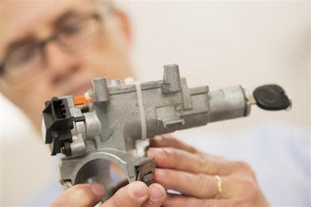 Consulting materials engineer Mark Hood shows the ignition assembly which has a faulty 2005 ignition switch (black piece at left), in the mechanical testing laboratory at McSwain Engineering, Inc. in Pensacola, Florida, March 28, 2014. REUTERS/Michael Spooneybarger