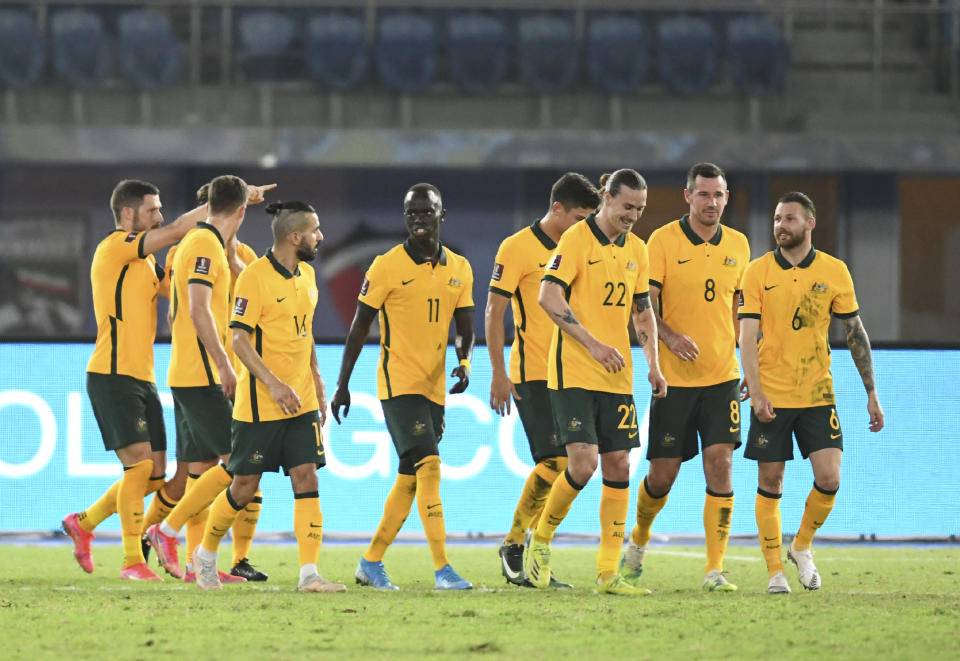 Australia's Jackson Irvine, third right, celebrates with his teammates after scoring his side's second goal during the World Cup 2022 Group B qualifying soccer match between Kuwait and Australia in Kuwait City, Kuwait, Thursday, June 3, 2021. (AP Photo/Jaber Abdulkhaleg)