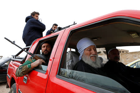 Syrian Druze are seen during an evacuation of rebels and civilians from Beit Jann, in Mogher al-Meer village, Syria December 29, 2017. REUTERS/Omar Sanadiki