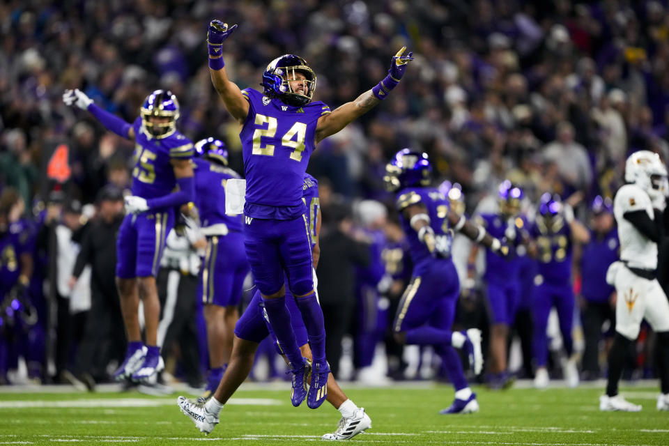 Washington safety Makell Esteen (24) reacts to a turnover on downs by Arizona State with less than a minute left in the game during the second half of an NCAA college football game Saturday, Oct. 21, 2023, in Seattle. Washington won 15-7. (AP Photo/Lindsey Wasson)