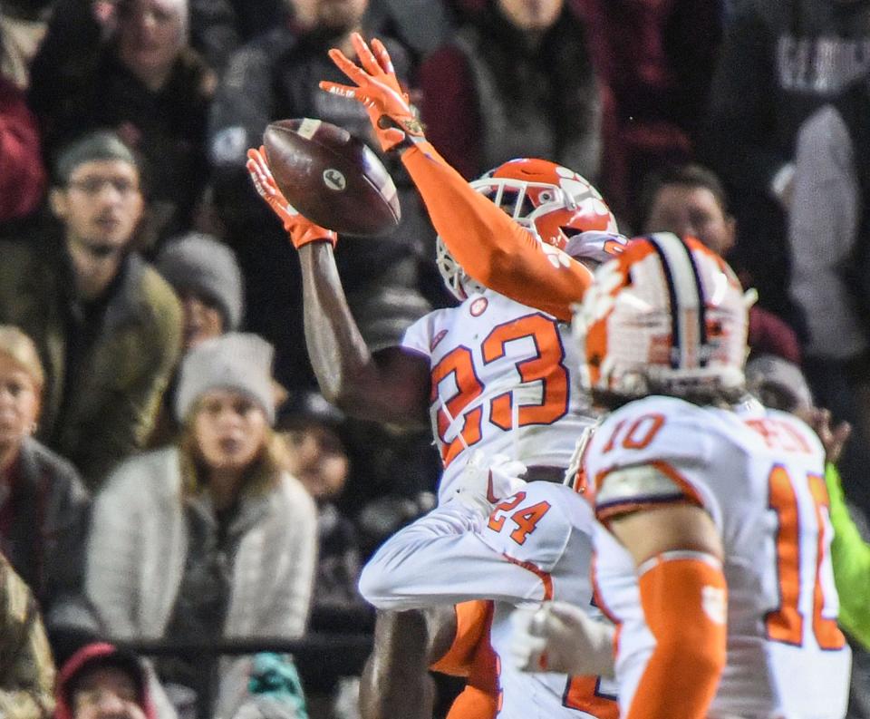 Clemson cornerback Andrew Booth Jr. makes one of his two interceptions in the first half Saturday against South Carolina.