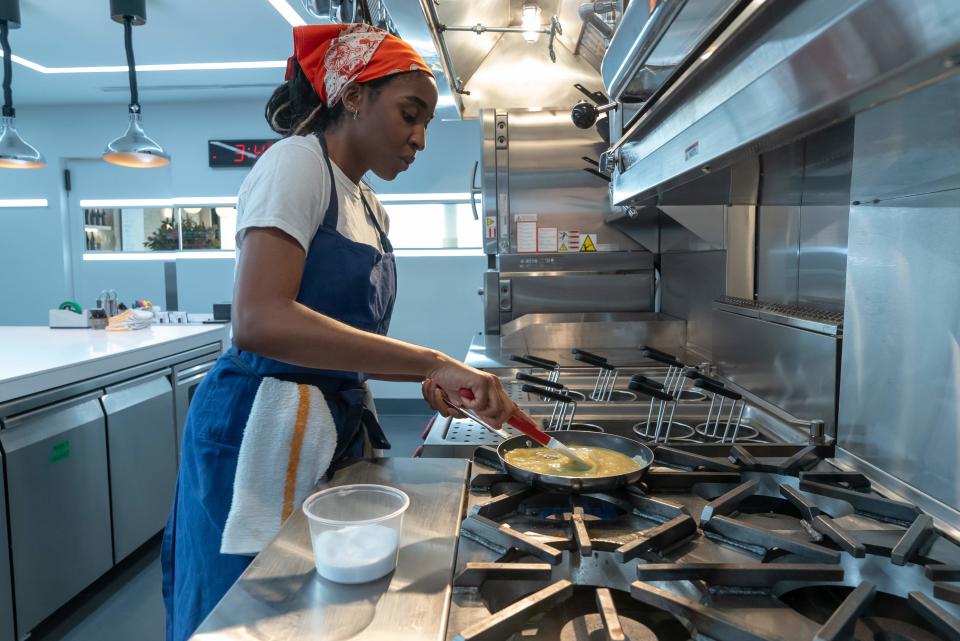 Ayo/Sydney making an omelet