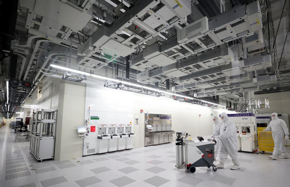 Manufacturing technicians work in a cleanroom, supporting semiconductor wafer fabrication, at Texas Instruments in Lehi on Thursday, Nov. 2, 2023. | Kristin Murphy, Deseret News