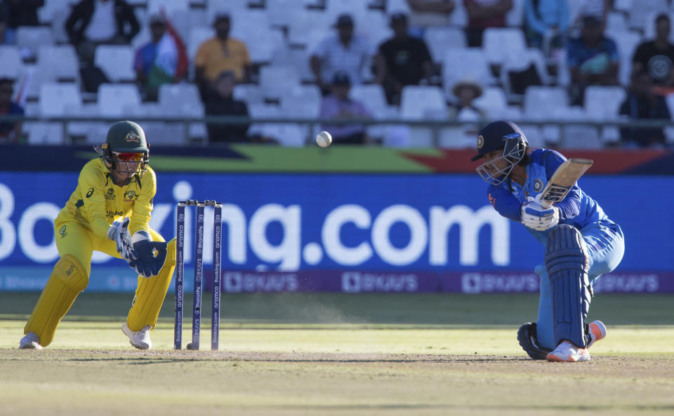 India's Sneh Rana swings at the ball while Australia's Alyssa Healy looks on during the Women's T20 World Cup semi final cricket match in Cape Town, South Africa, Thursday Feb. 23, 2023. (AP Photo/Halden Krog)