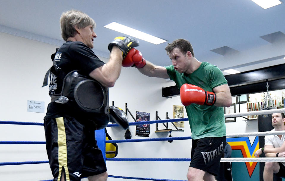 Australian boxer Jeff Horn hits the pads with trainer Glenn Rushton during a training session at the Stretton Boxing Club on August 17, 2020 in Brisbane, Australia. Horn will next fight against Tim Tszyu in Townsville on August 26th.