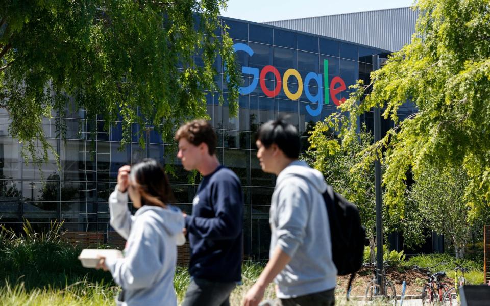 Google employees walk through Mountain View campus