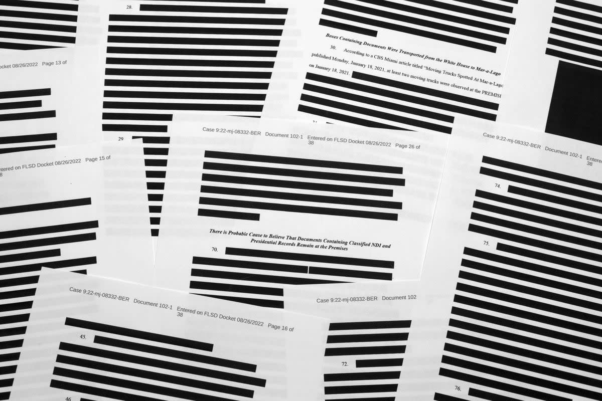 Pages from the affidavit from the FBI, with multiple redactions  (Copyright 2022 The Associated Press. All rights reserved.)