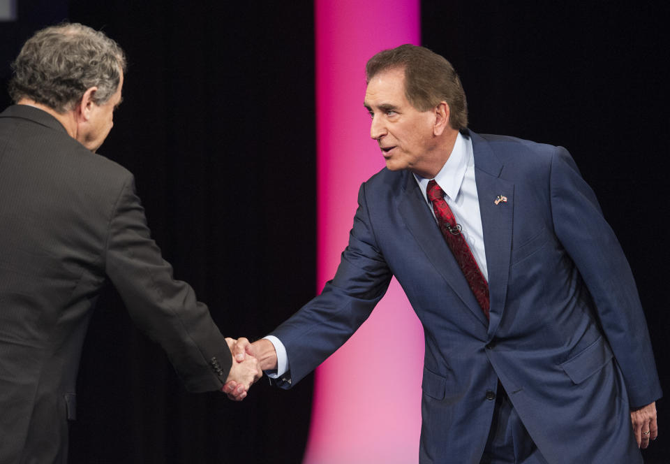 Brown (left) shakes hands with Renacci during an October debate. (Photo: THE ASSOCIATED PRESS)