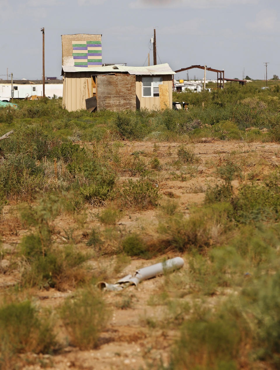 The home of Seth Aaron Ator, the alleged gunman in a West Texas rampage Saturday, is pictured Monday, Sept. 2, 2019, near Odessa, Texas. Officers killed 36-year-old Ator on Saturday outside a busy Odessa movie theater after a spate of violence that spanned 10 miles (16 kilometers), killing multiple people and injuring around two dozen others. (AP Photo/Sue Ogrocki)