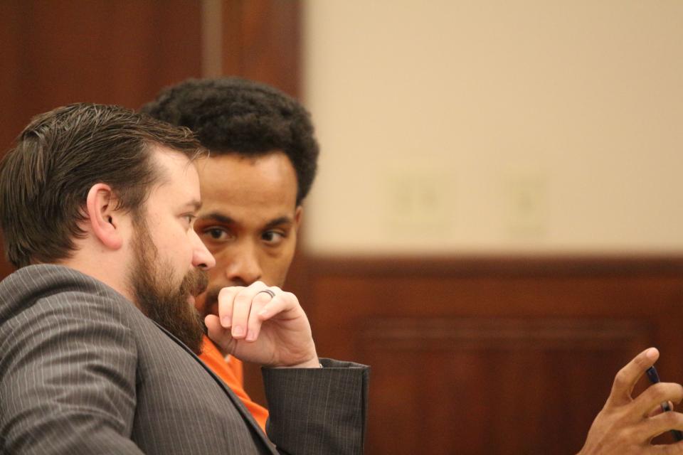 Vincent Bryan Merriweather talks to his attorney, Jacob Fendley at his preliminary hearing on homicide charge